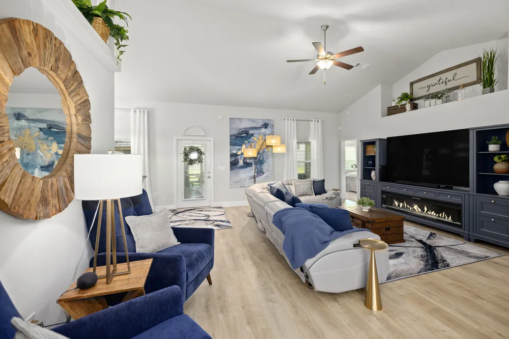 Blue accent living room by Joy Signature Designs